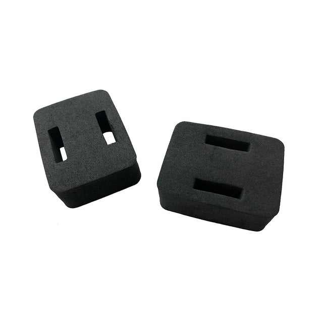 two foam blocks with two slots in each pictures on a white background